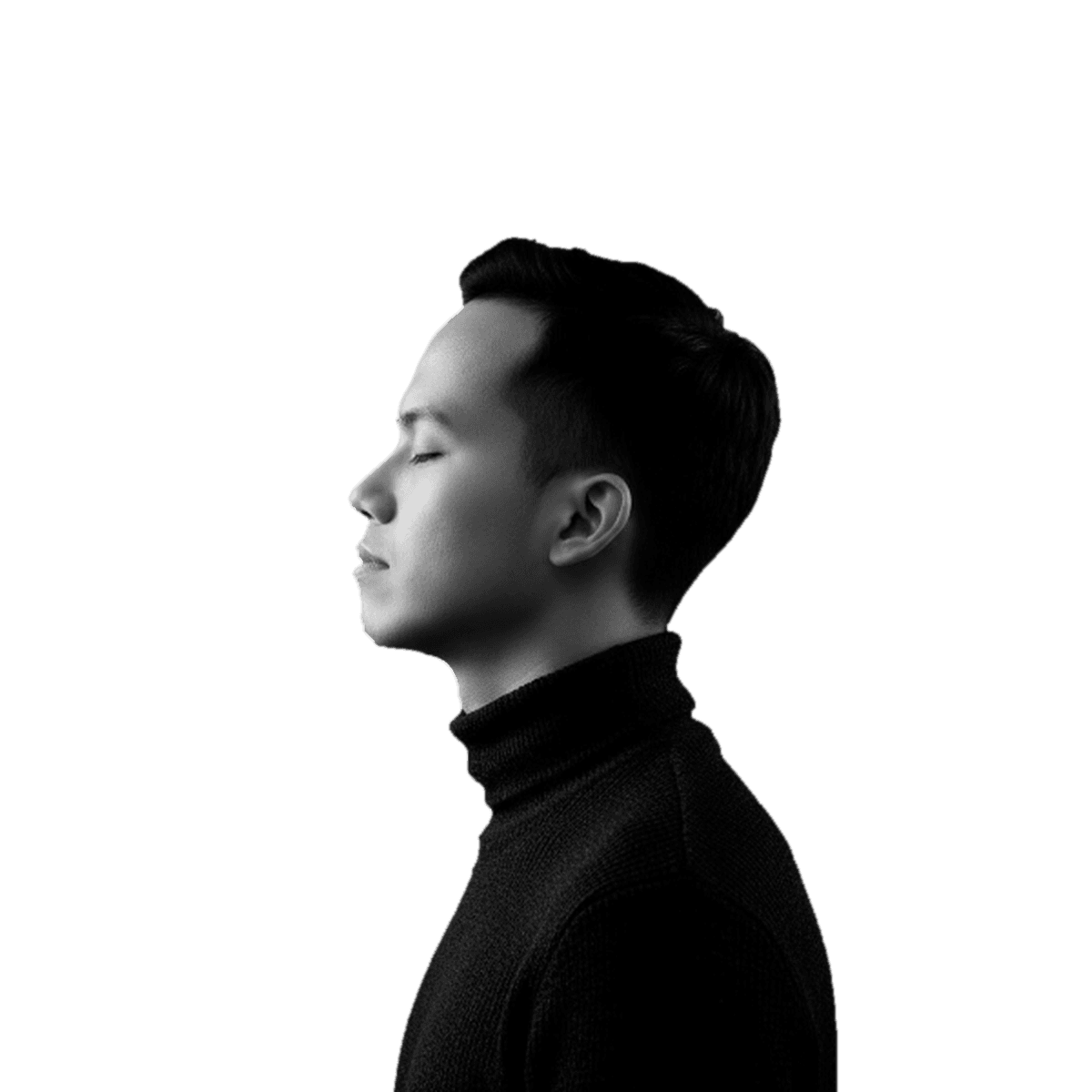 Portrait of Paolo Espero in profile, wearing a black turtleneck.
